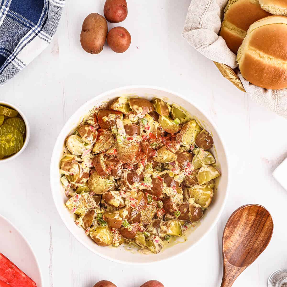 Finished potato salad in a bowl.
