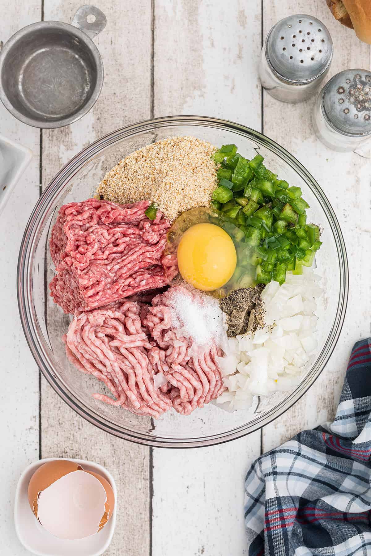 Burger ingredients inside a large mixing bowl.