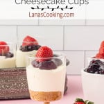 Finished individual no bake cheesecake cups topped with strawberries.