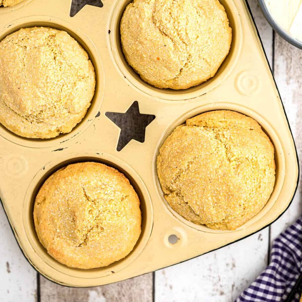 Finished muffins in a baking tin.