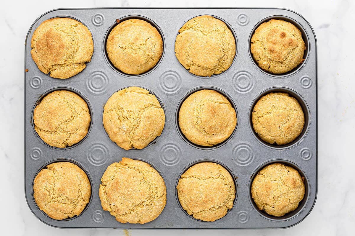 Muffin tin holding baked muffins.