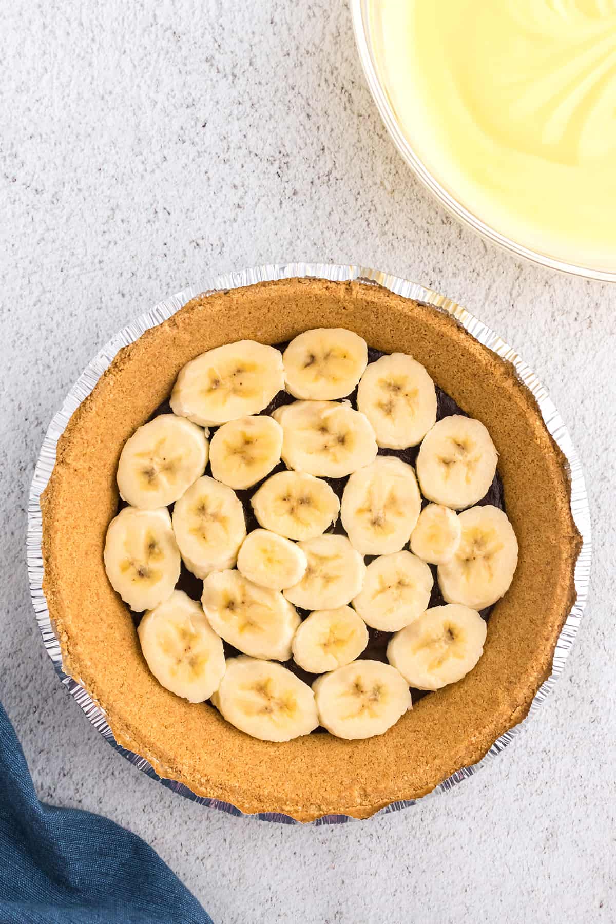 Banana slices layered in a pie crust.