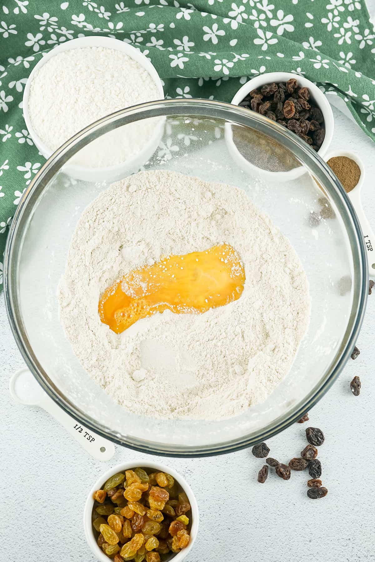 Egg added to dry ingredients in bowl.