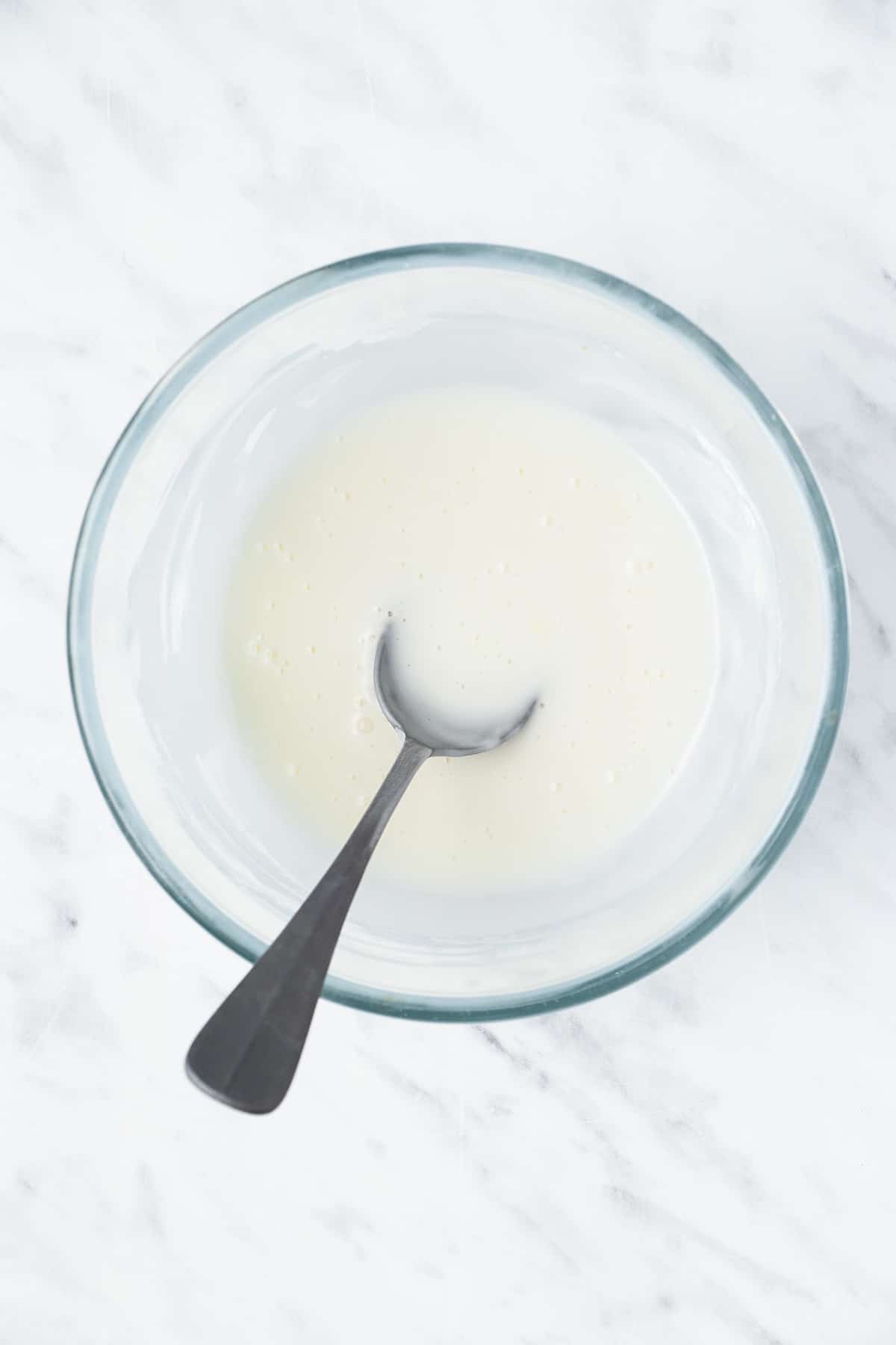 Lemon sugar glaze in a mixing bowl.