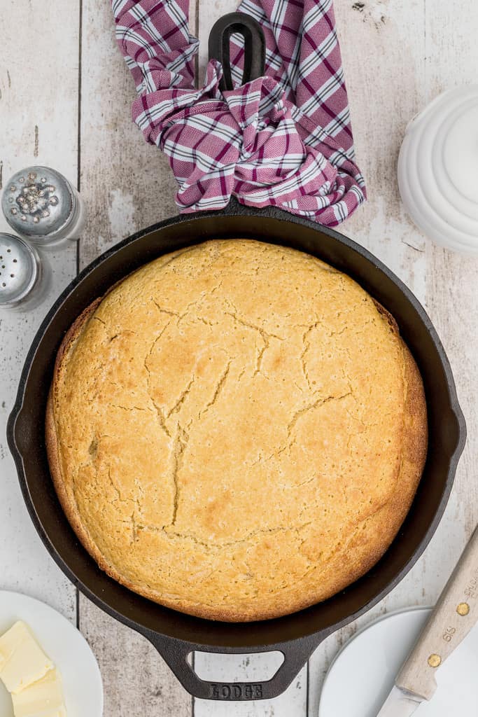 Baked cornbread cooling in the skillet.