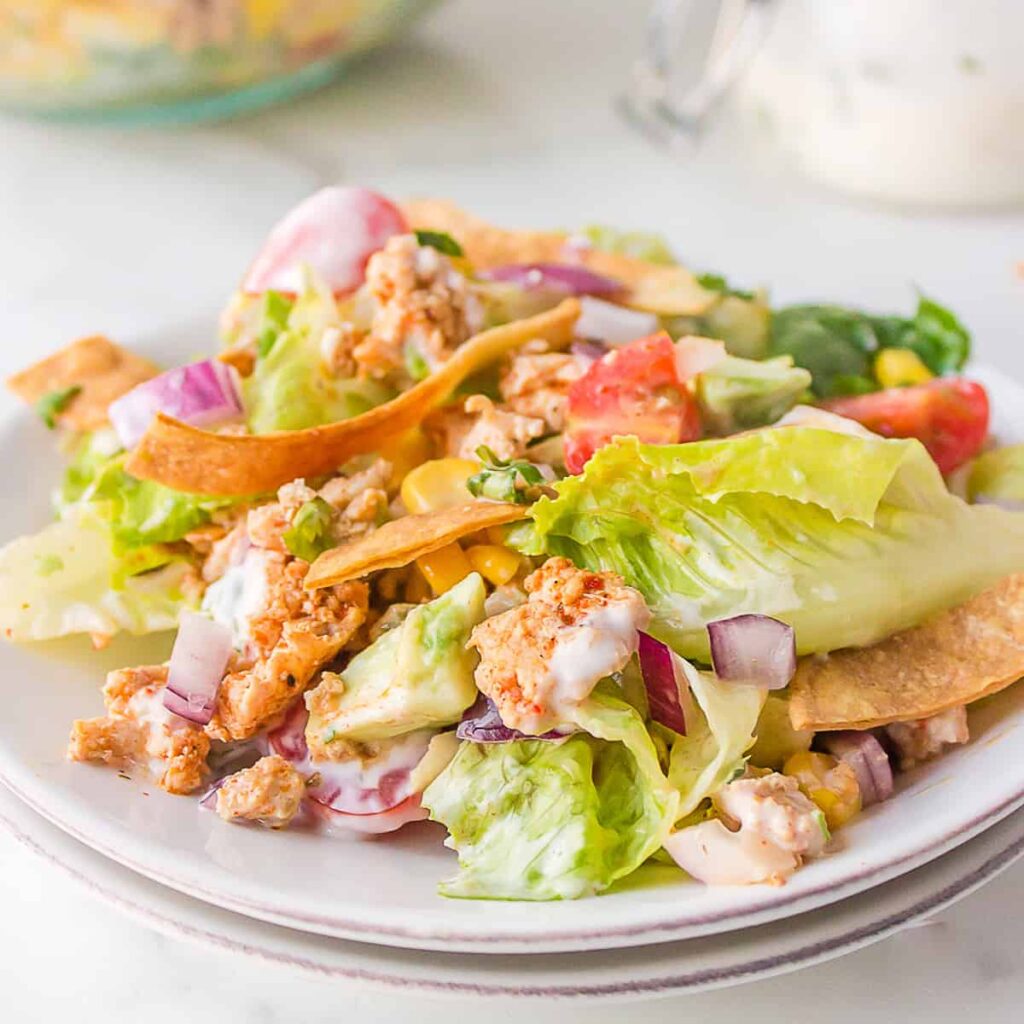 Finished turkey taco salad on a white serving plate.