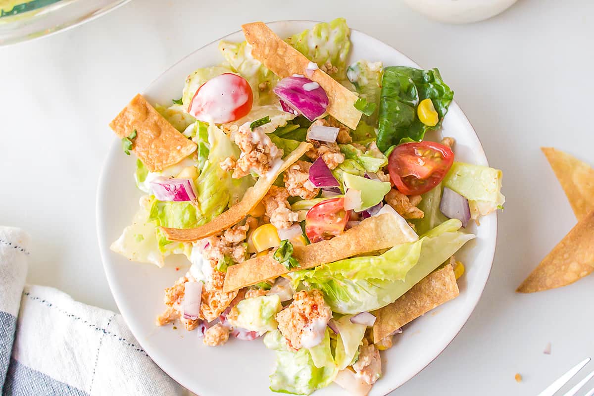 Finished turkey taco salad on a white serving plate.