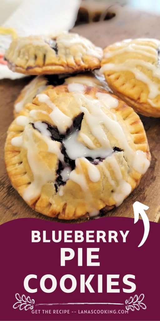 Finished blueberry pie cookies on a wooden board.