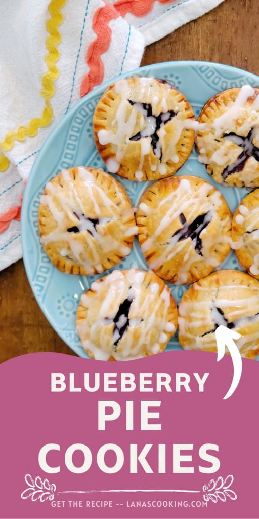 Finished blueberry pie cookies on a blue plate.