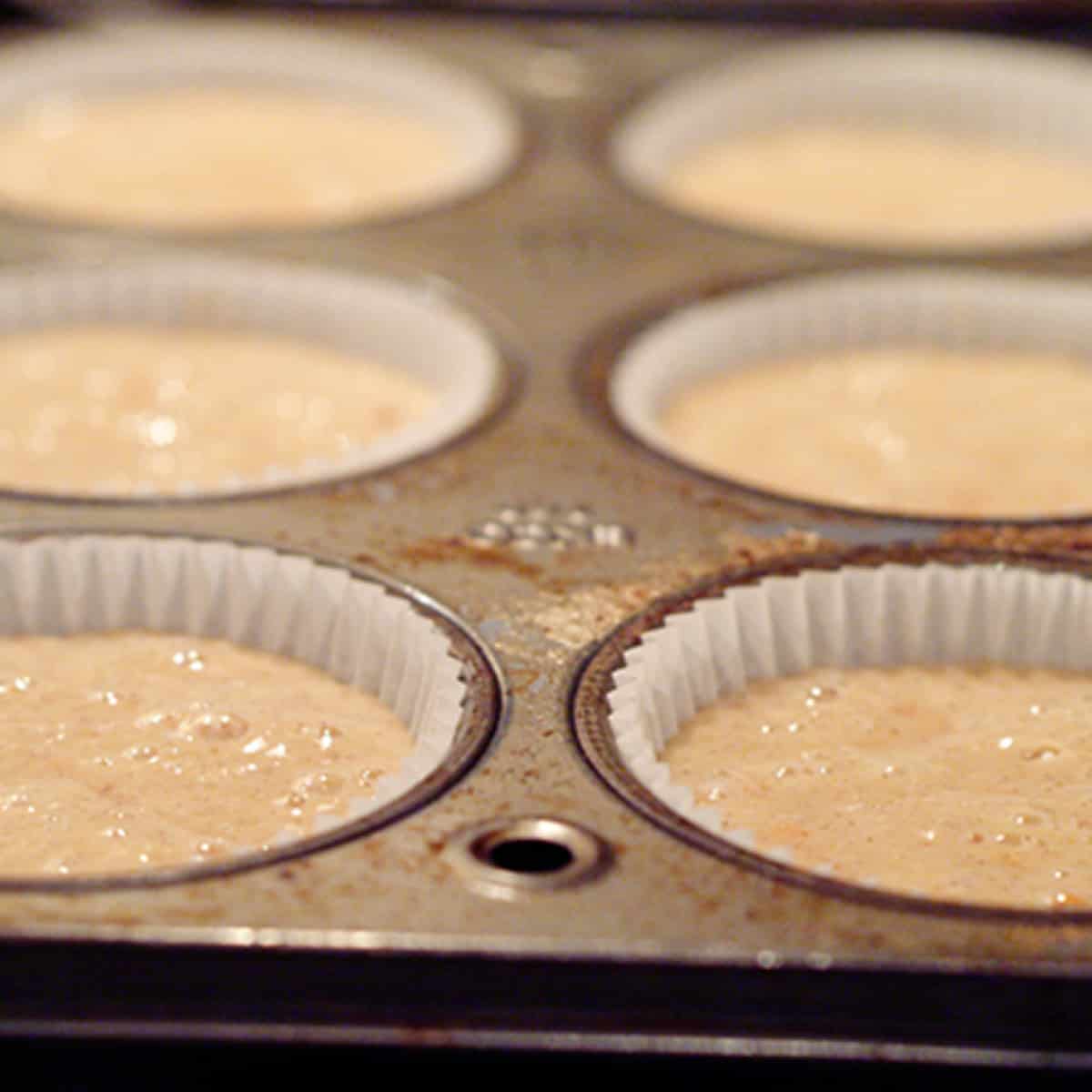 Muffin pan filled with batter.