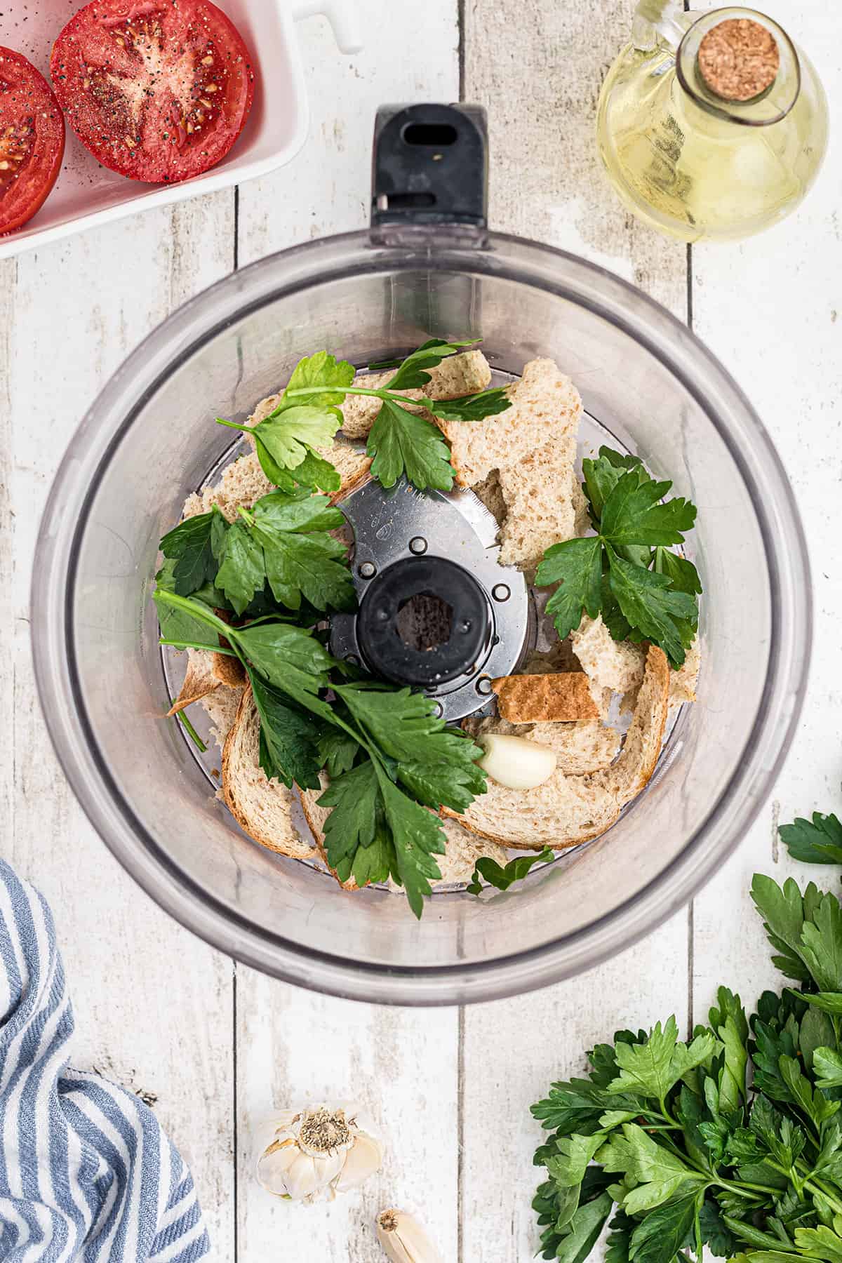 Bread and fresh parsley in a food processor.