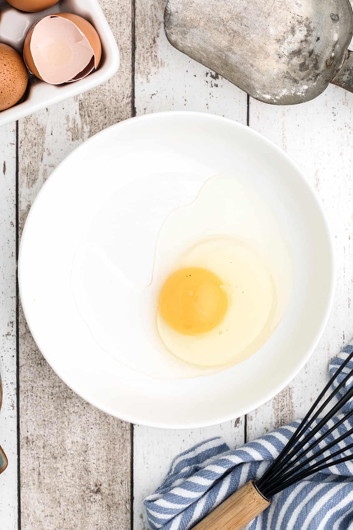 White bowl with an egg.
