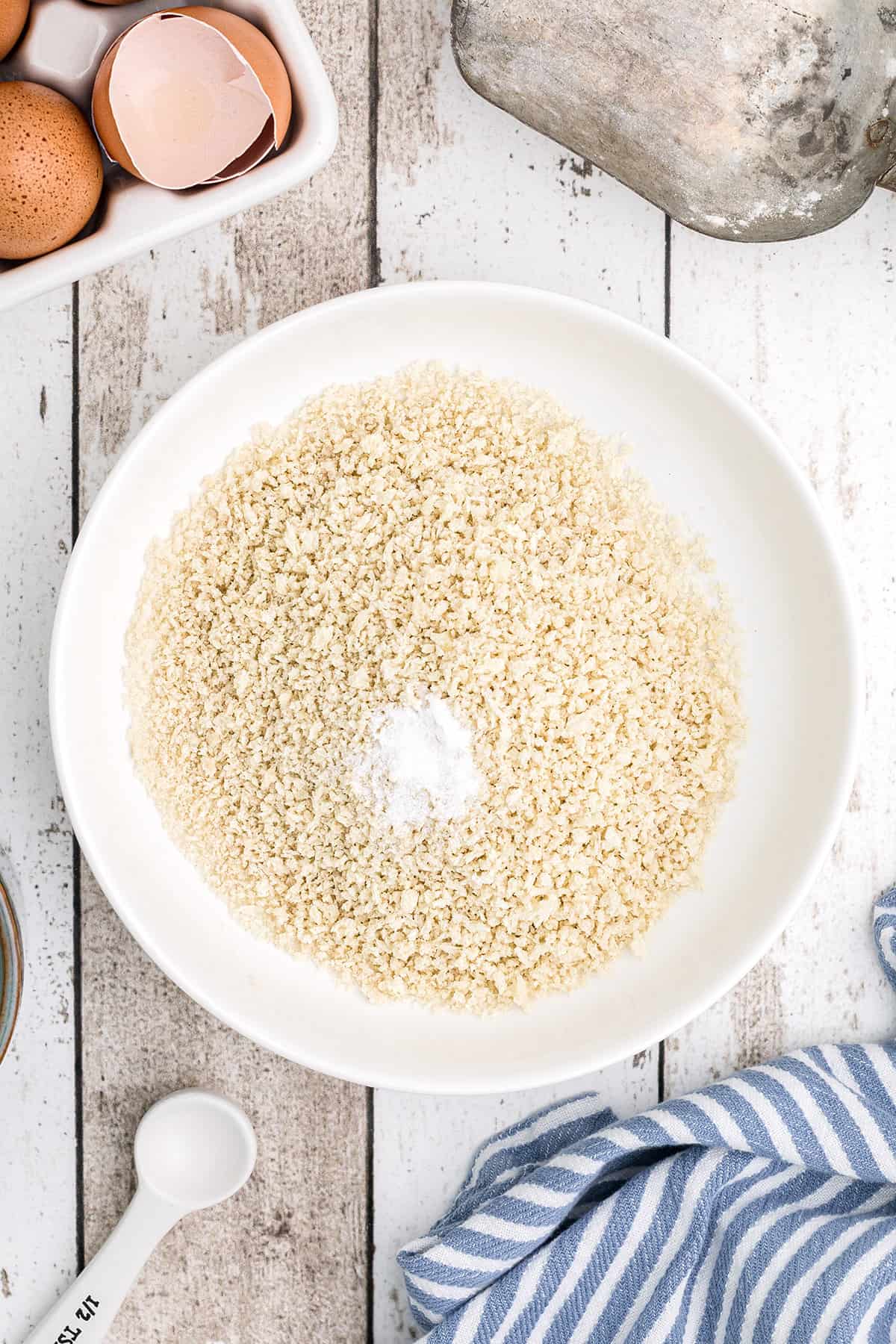 White bowl with breadcrumbs.