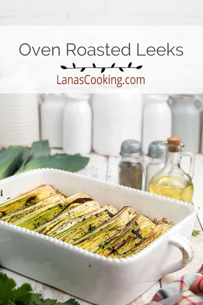 Roasted leeks in a baking dish.