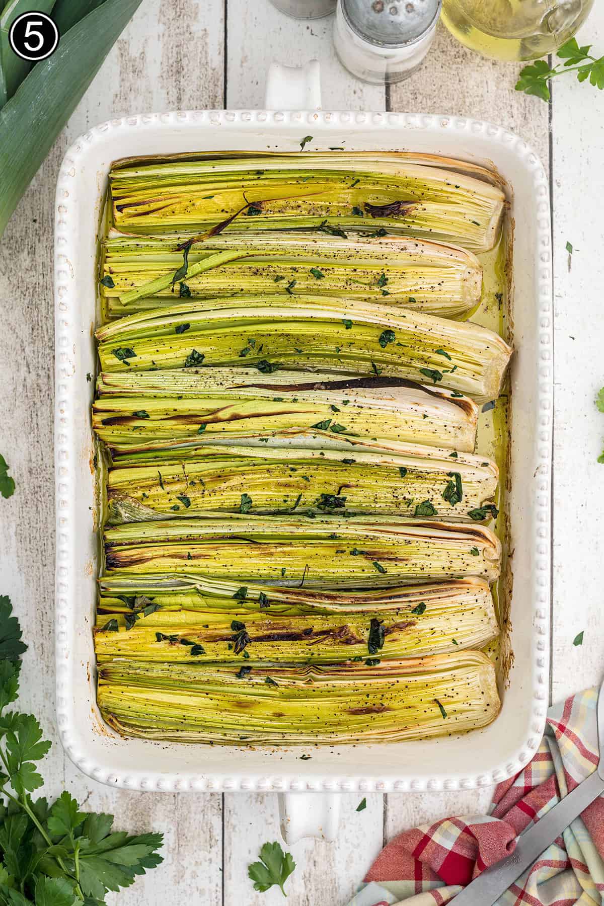 Baked leeks in a dish.