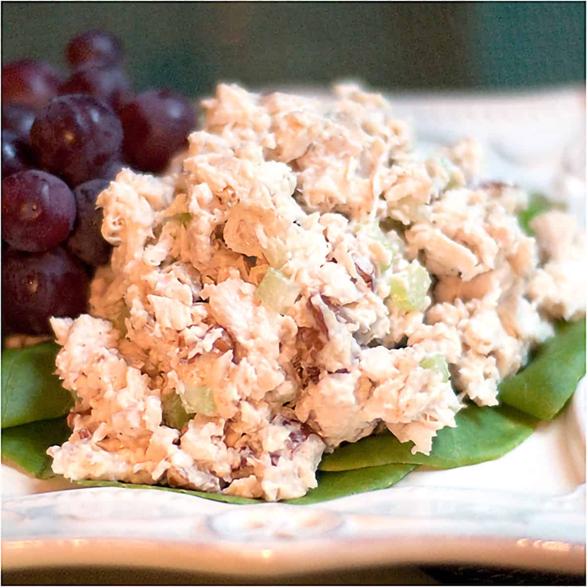 Chicken salad mounded on a serving plate.