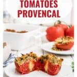 Halved baked tomatoes with breadcrumb topping on a plate, with whole tomatoes and a casserole dish in the background.