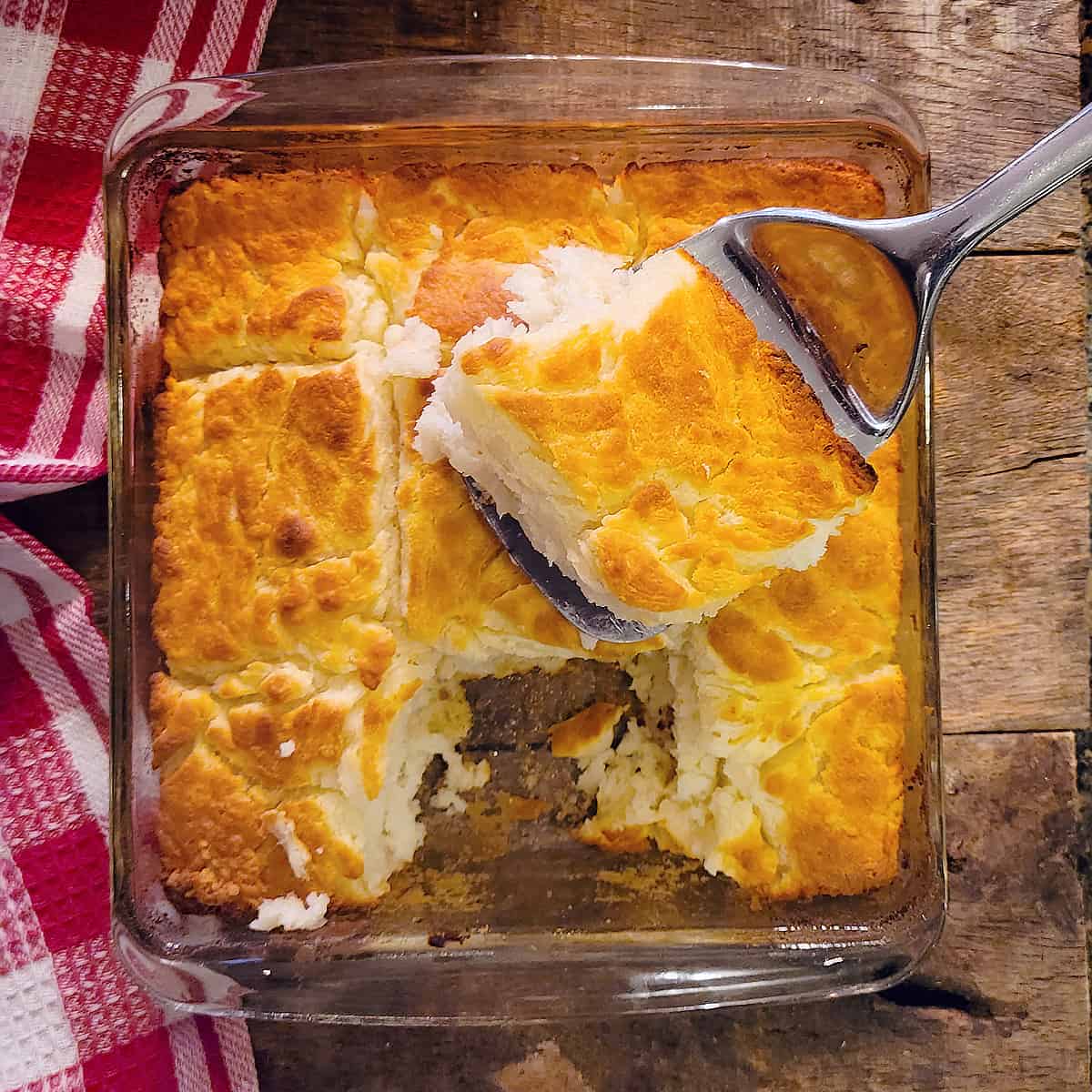 A glass baking dish filled with butter swim biscuits.