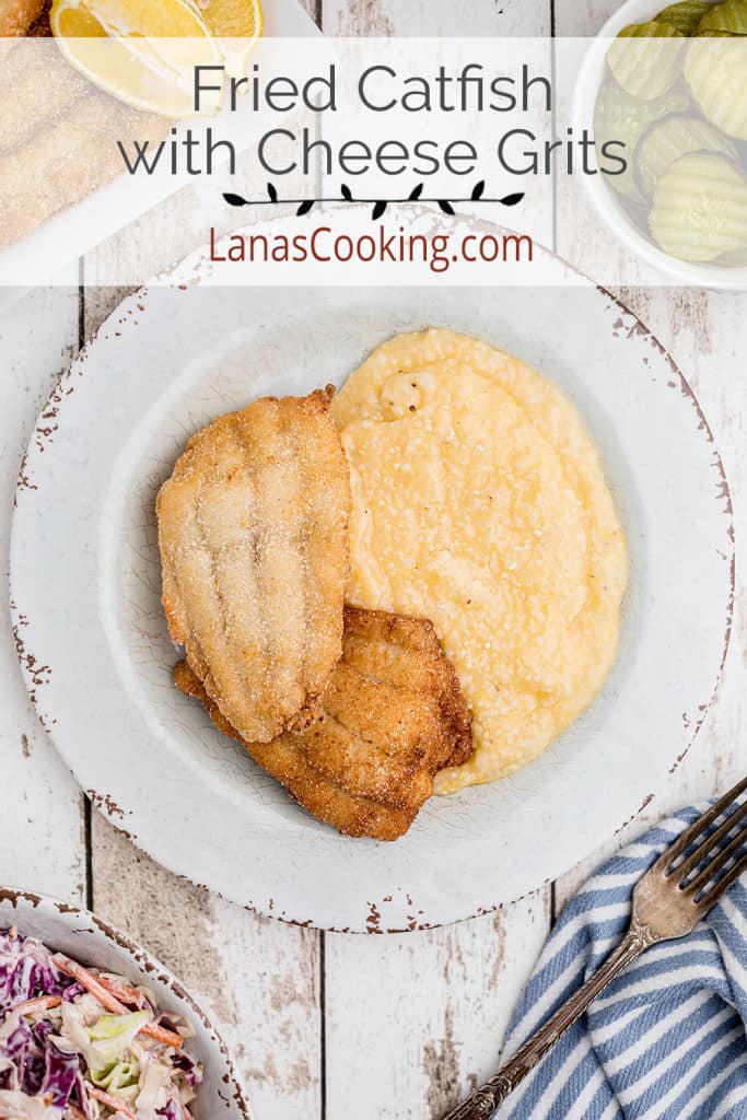 Fried catfish and cheese grits on a serving plate.