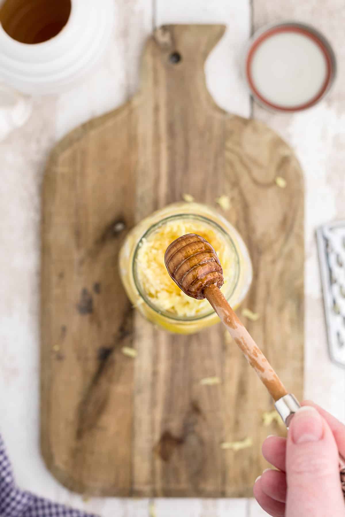 Filling the jar with honey.