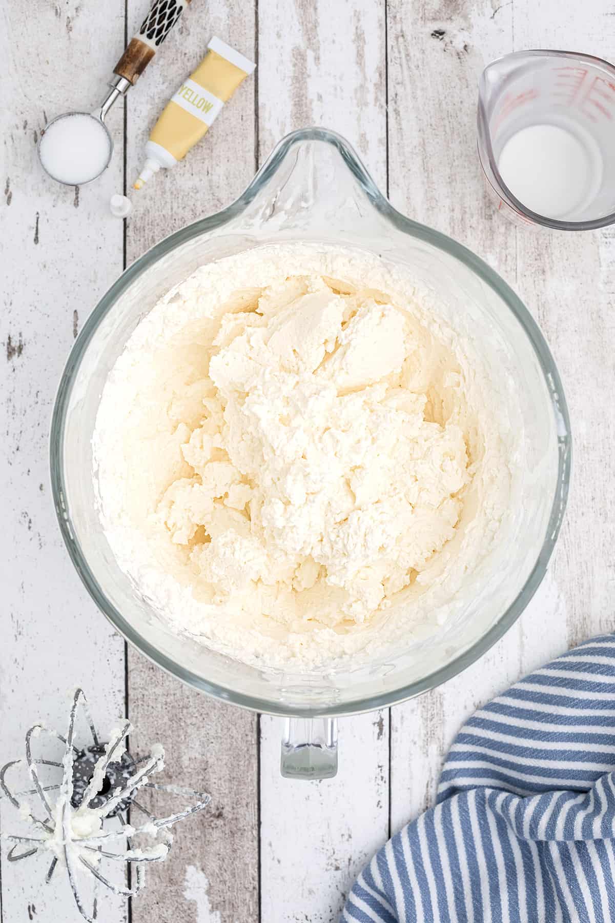 Butter and buttermilk separated in the mixing bowl.