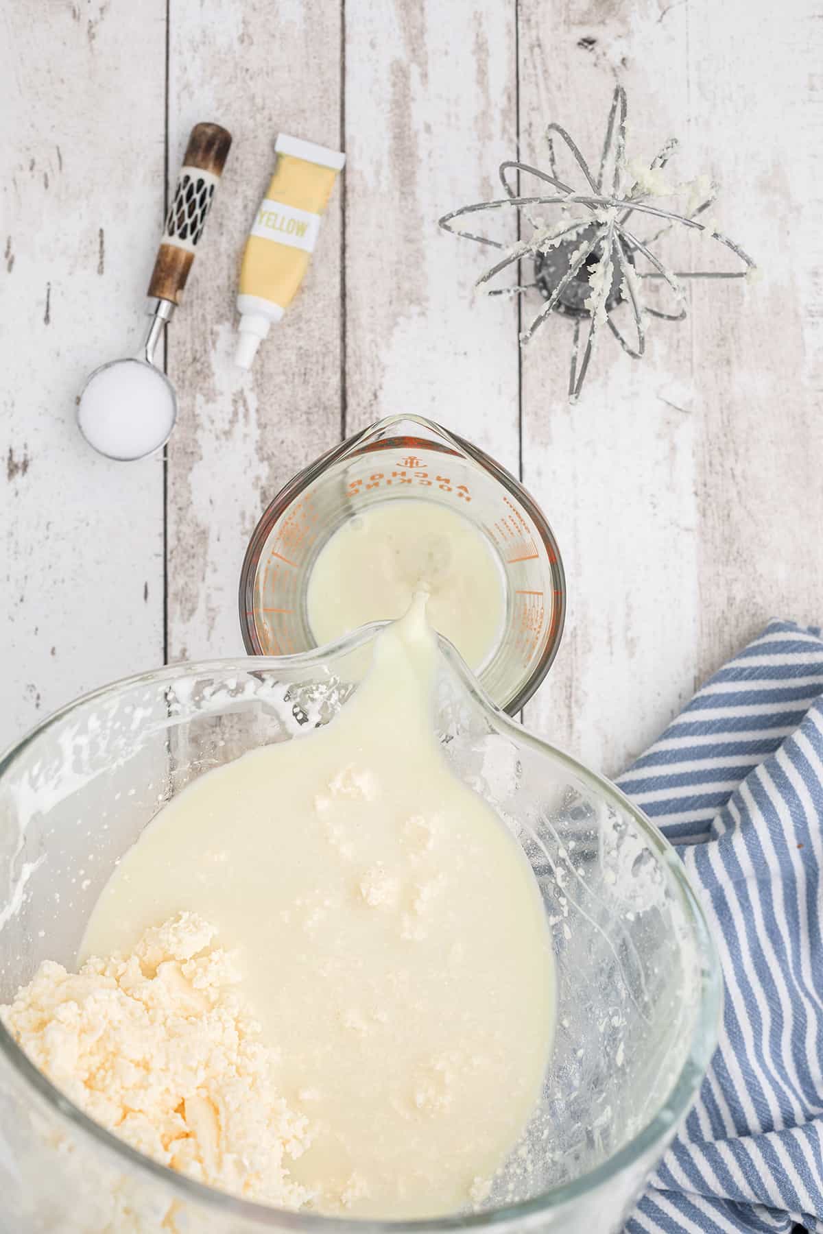 Pouring off the buttermilk.