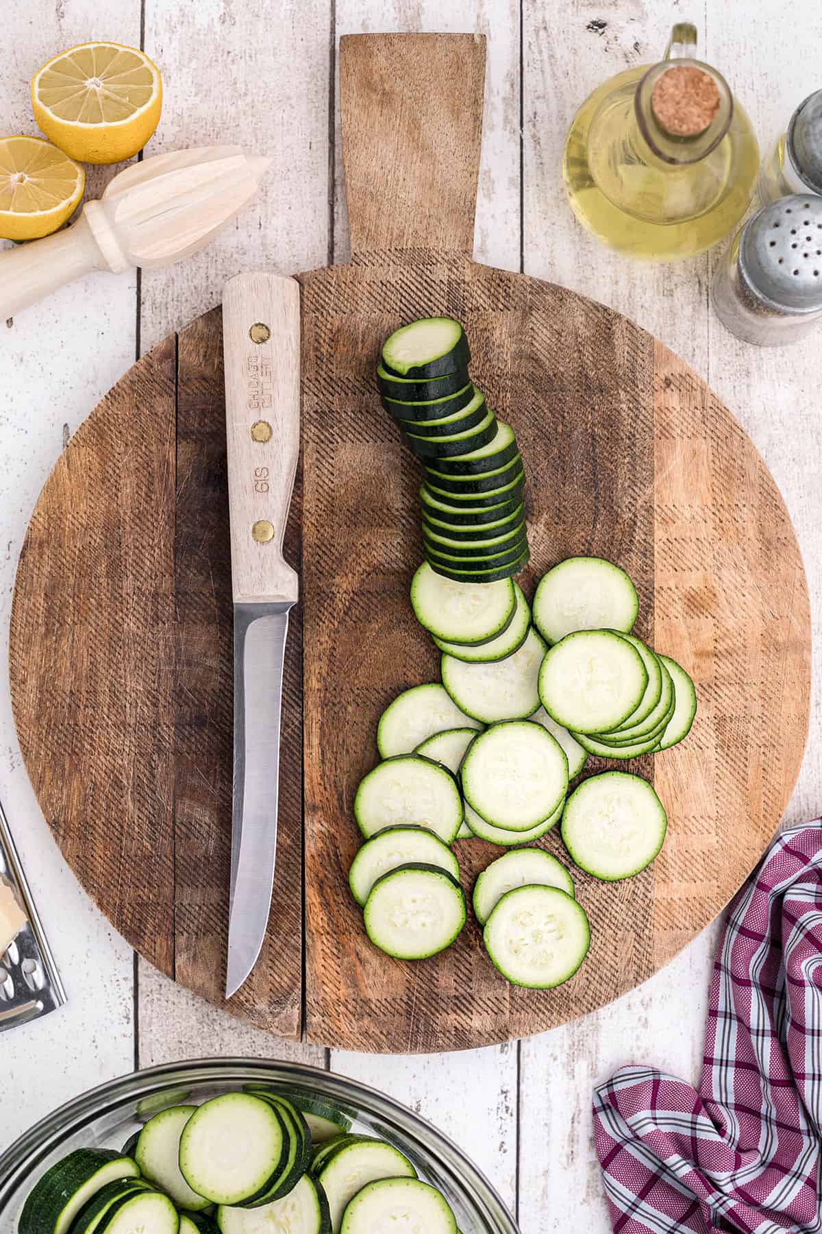 Sliced zucchini on a cutting board.