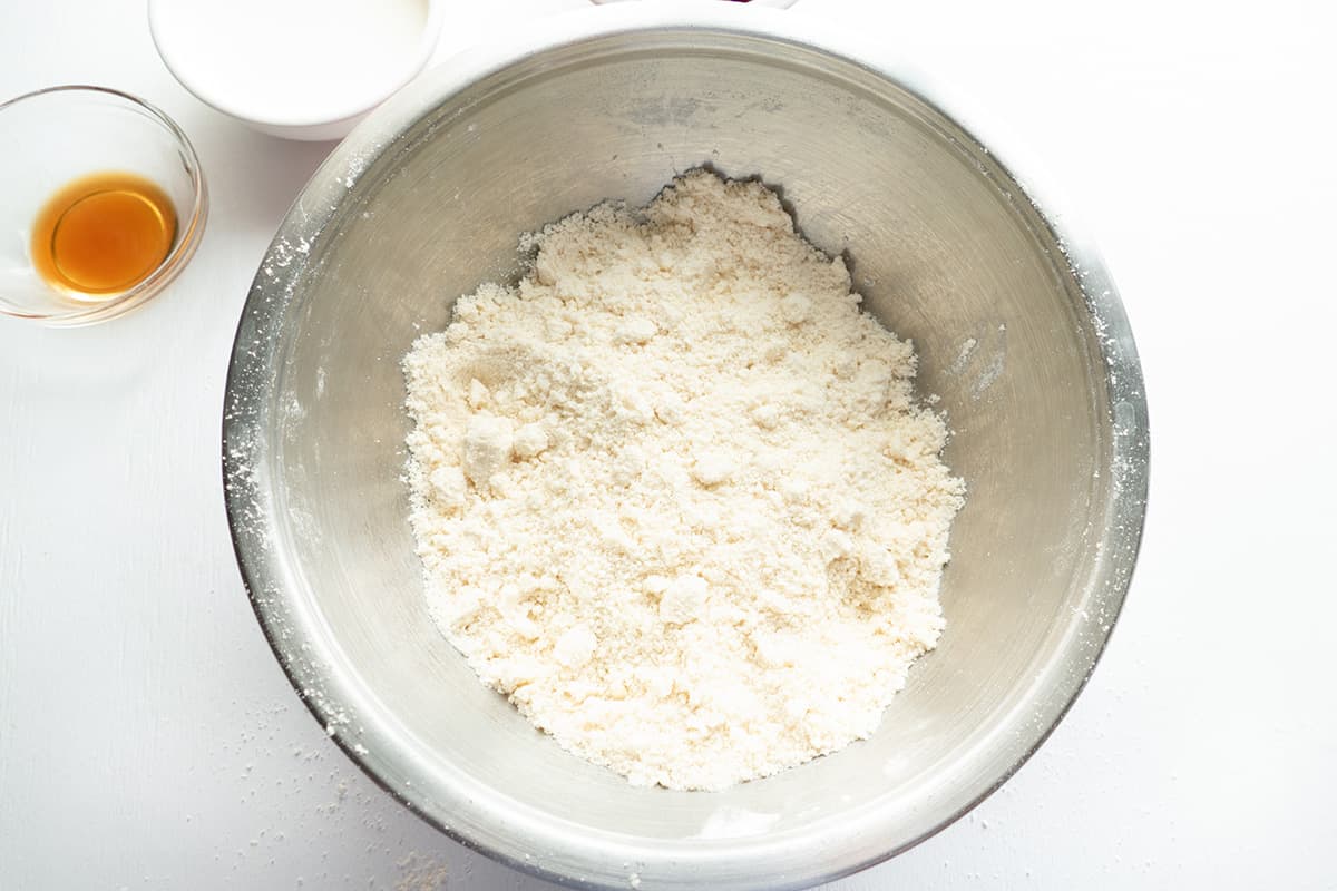 Butter cut into ingredients in mixing bowl.