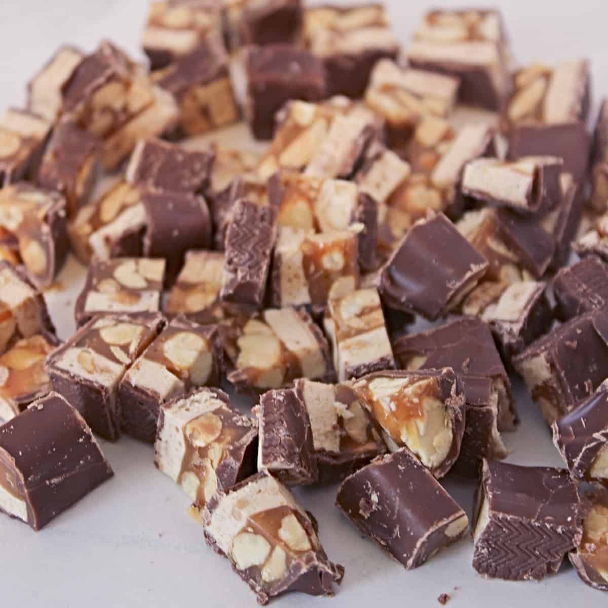 Snickers bars chopped into small pieces.