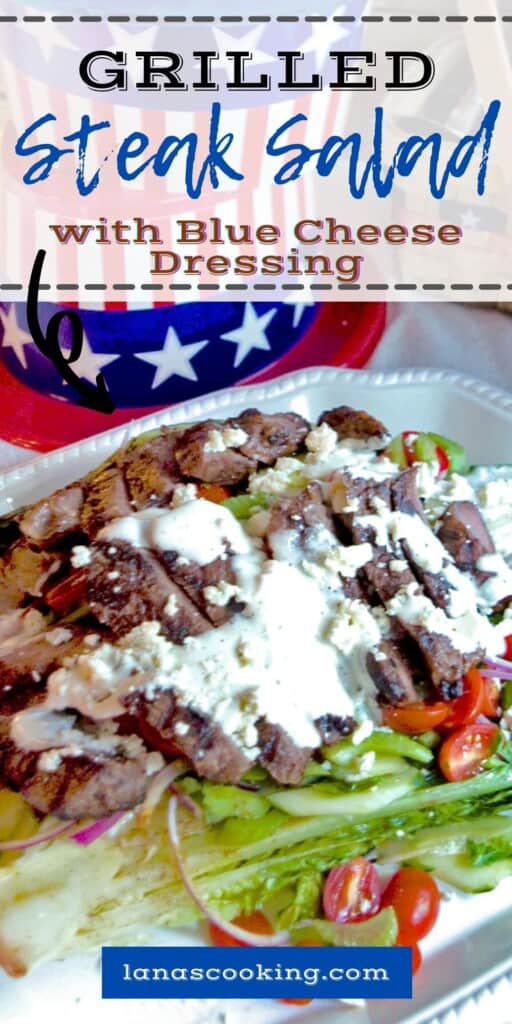 Grilled steak salad with blue cheese dressing on a serving platter.