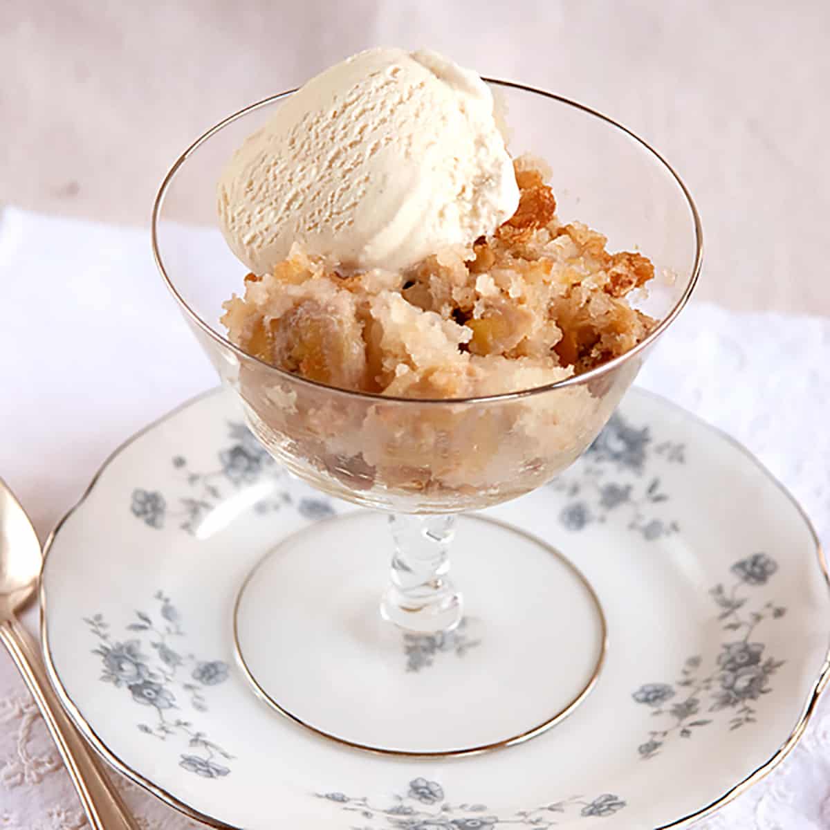 A serving of banana bread cobbler with ice cream.
