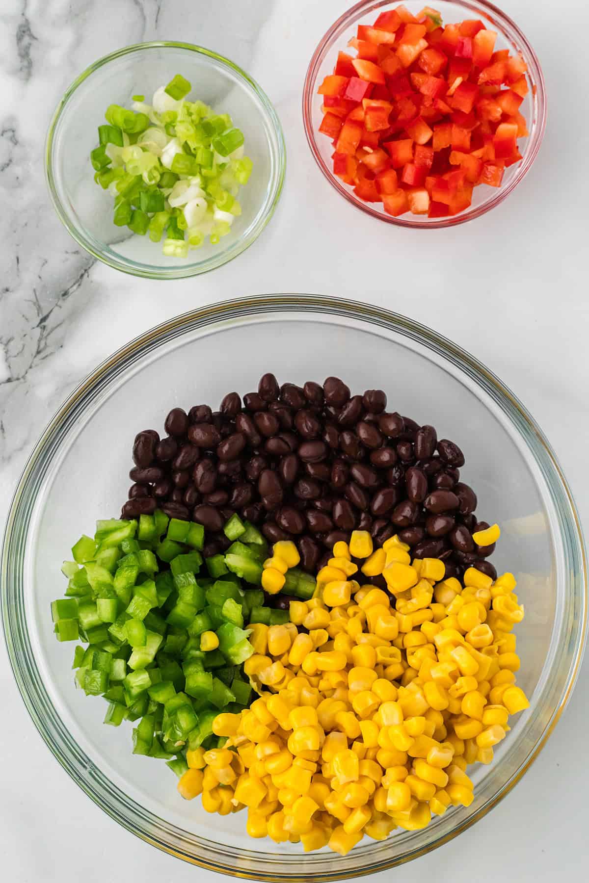 Drained corn added to the mixing bowl.