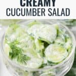 A glass bowl filled with creamy cucumber salad garnished with a sprig of dill. The text above the salad reads Creamy Cucumber Salad, and the bottom corner has the Lana’s Cooking logo.