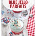 Glass cups of layered red, white, and blue Jello parfaits topped with whipped cream and sprinkles.