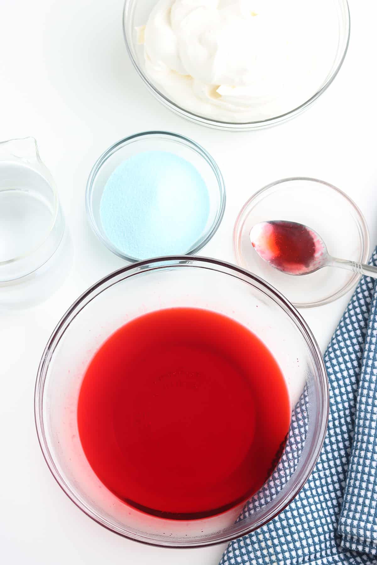Dissolved red gelatin in a mixing bowl.