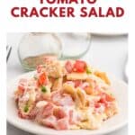 A plate of Southern tomato cracker salad with chopped tomatoes, crackers, and creamy dressing.