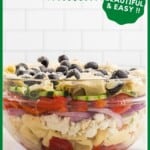 Finished salad layered in a glass bowl.