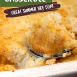 A close-up of a baked corn casserole in a white dish with a serving spoon holding a portion. Text on the image reads Baked Corn Casserole: Great Summer Side Dish! lanascooking.com.