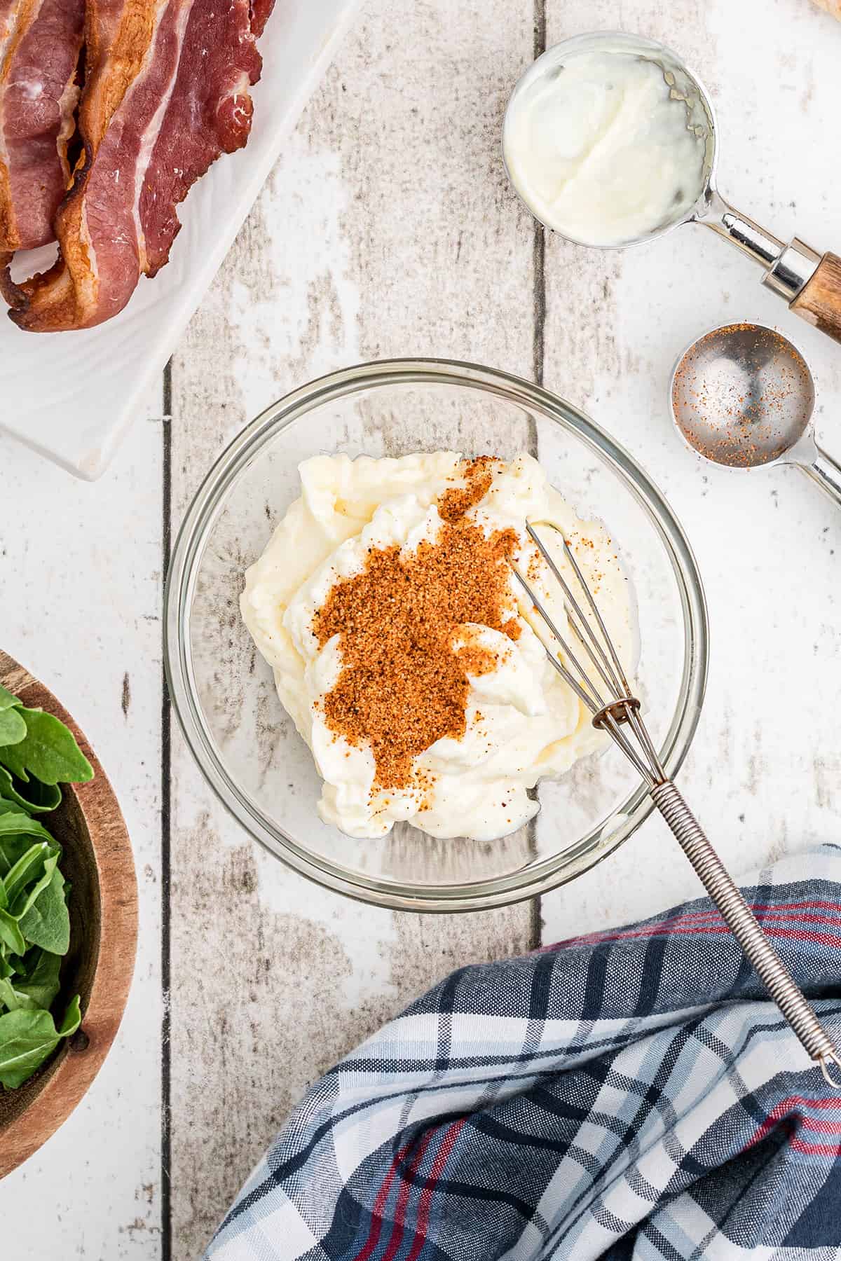 Mayonnaise and seasoned salt in a small mixing bowl.