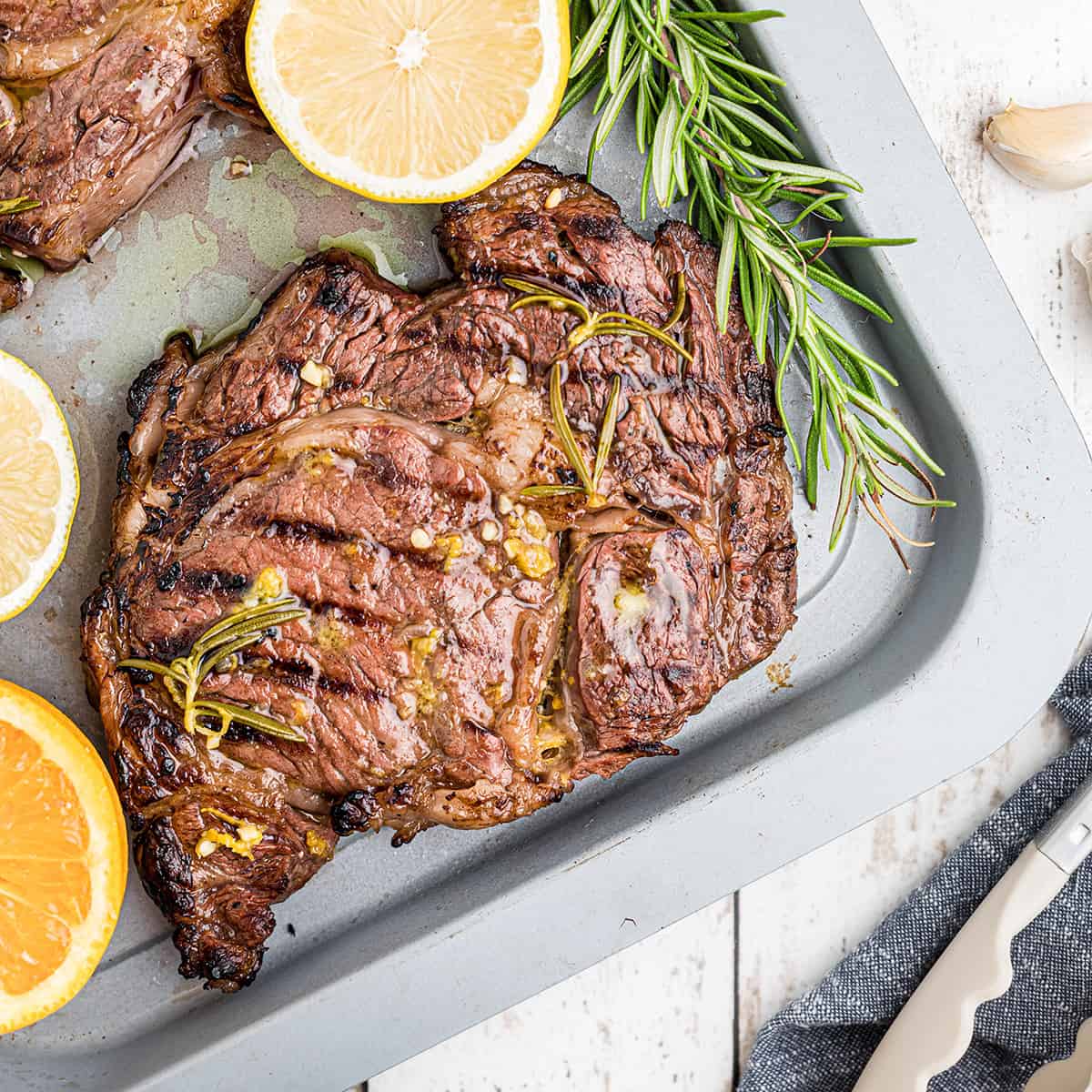 Finished ribeye steak on a pan.