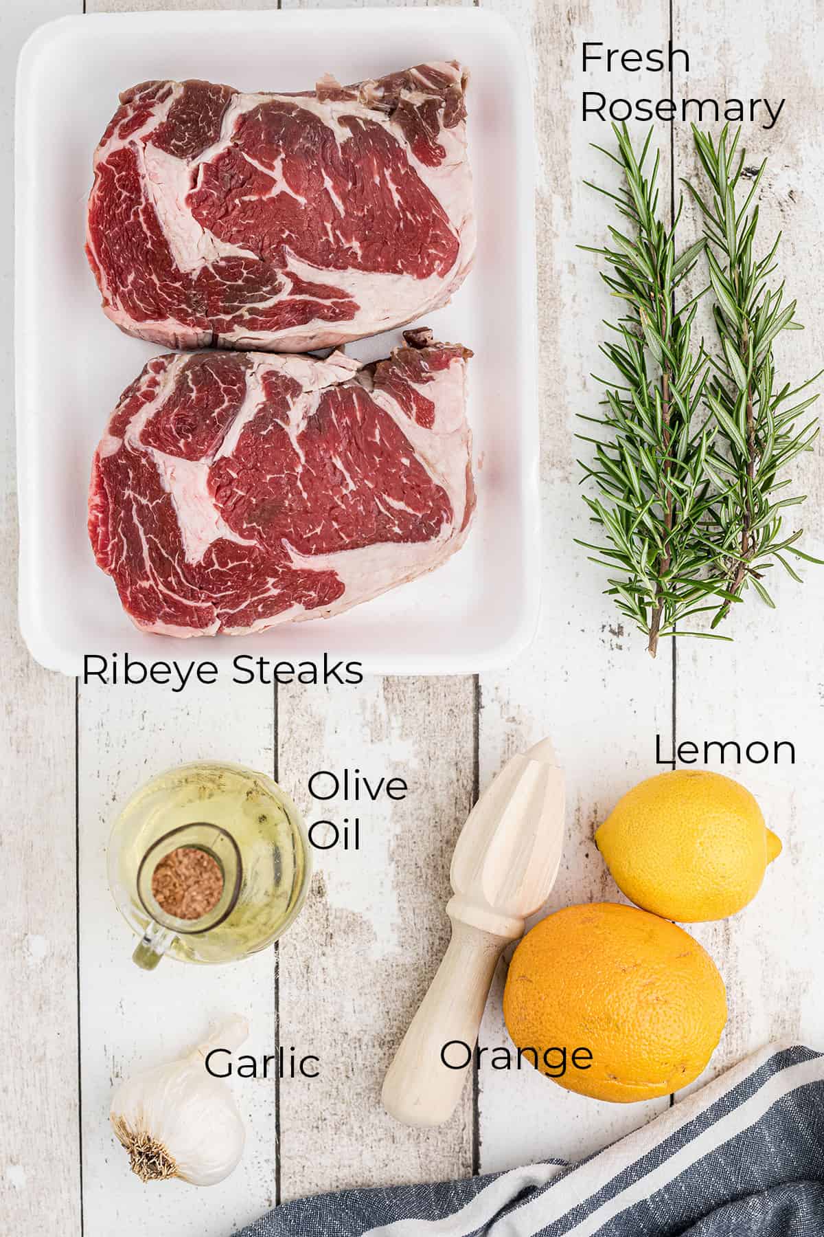 Ingredients needed for citrus marinated ribeye steaks.