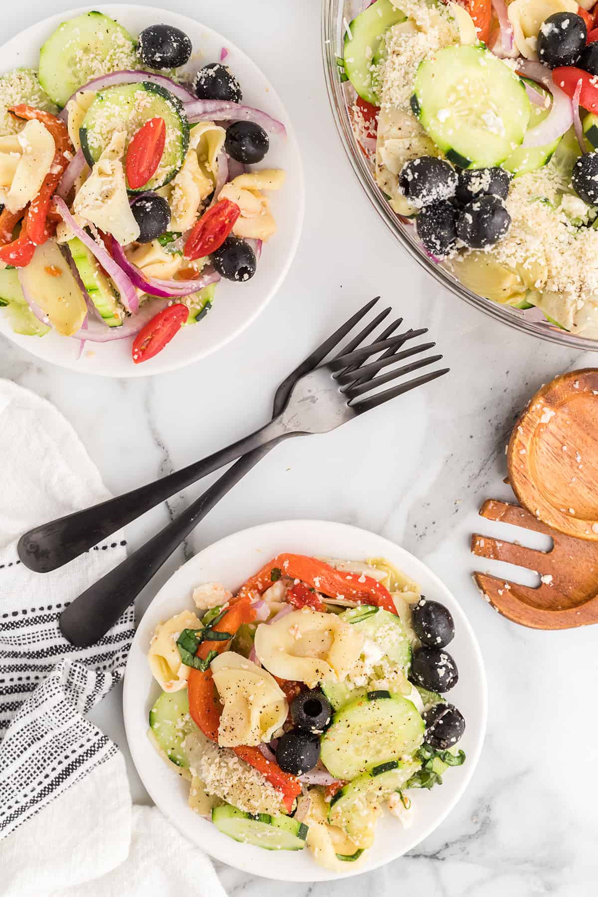 Tortellini salad served on individual plates.