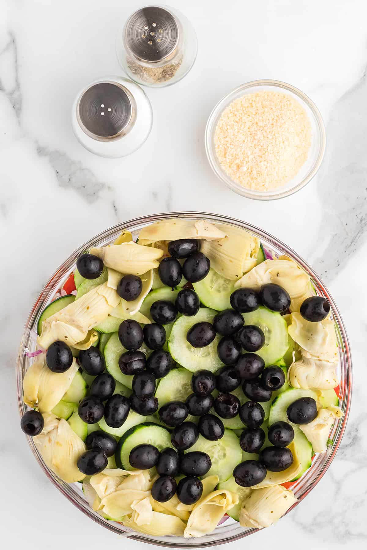 Black olives on top of salad.