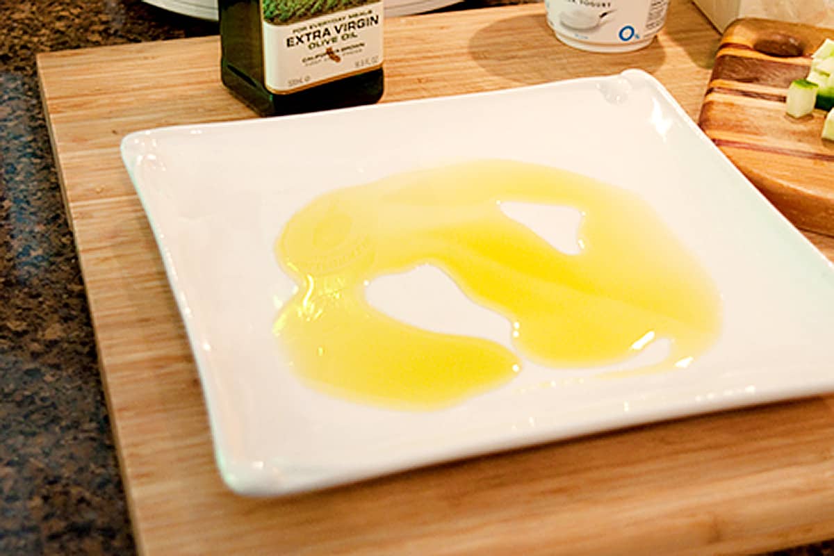 Olive oil on a white platter.