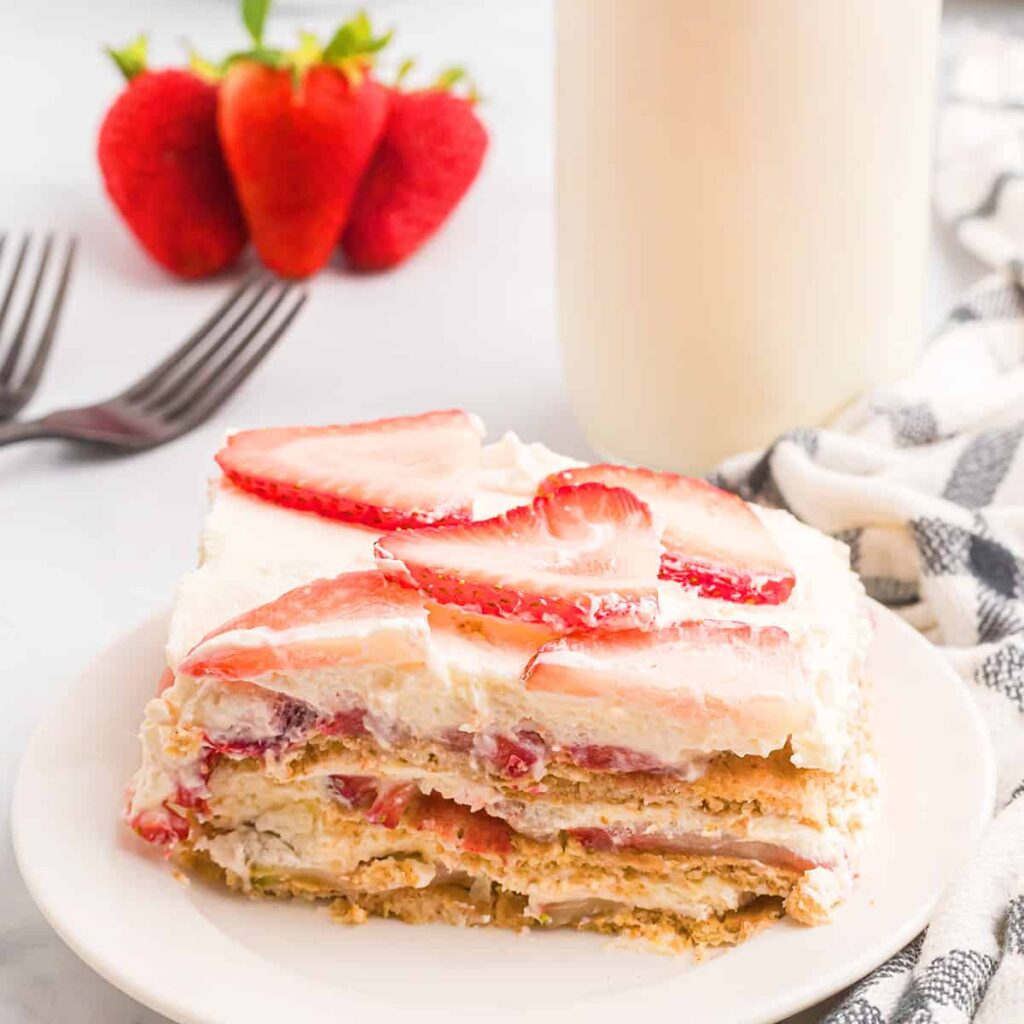 A serving of strawberry icebox cake on a white plate.