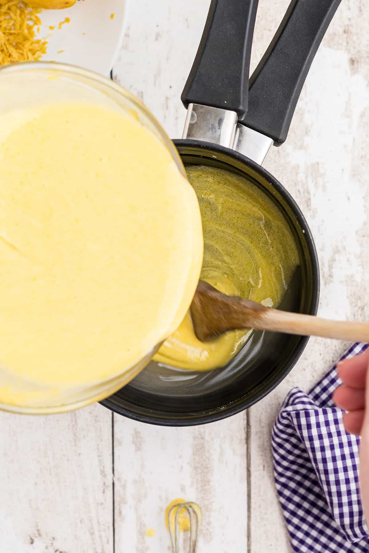 Adding tempered filling back to the pan.