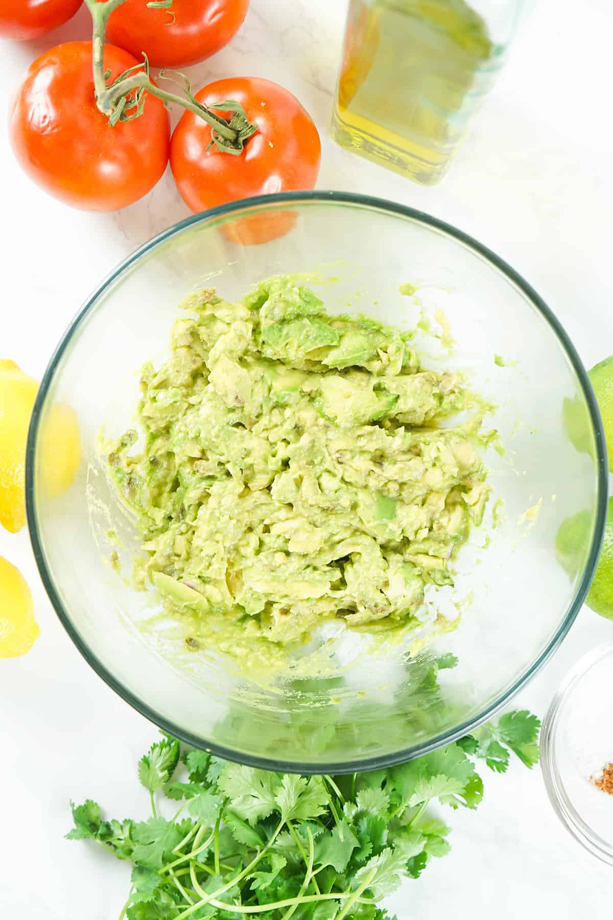 Mashed avocado in a mixing bowl.