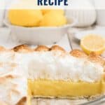 A sliced lemon meringue pie with lemons in the background and text reading Lemon Meringue Pie Recipe.