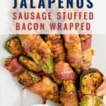 A plate of bacon-wrapped jalapenos stuffed with sausage and cheese, served with a bowl of creamy dipping sauce. Text on the image reads Jalapenos Sausage Stuffed Bacon Wrapped and lanascooking.com.