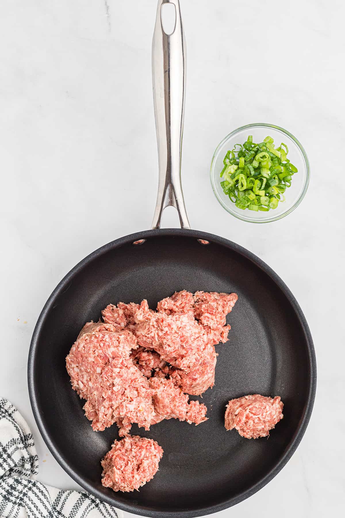 Bulk sausage in a skillet.